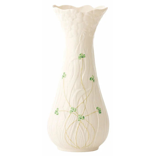 White vase with green floral patterns on a white background
