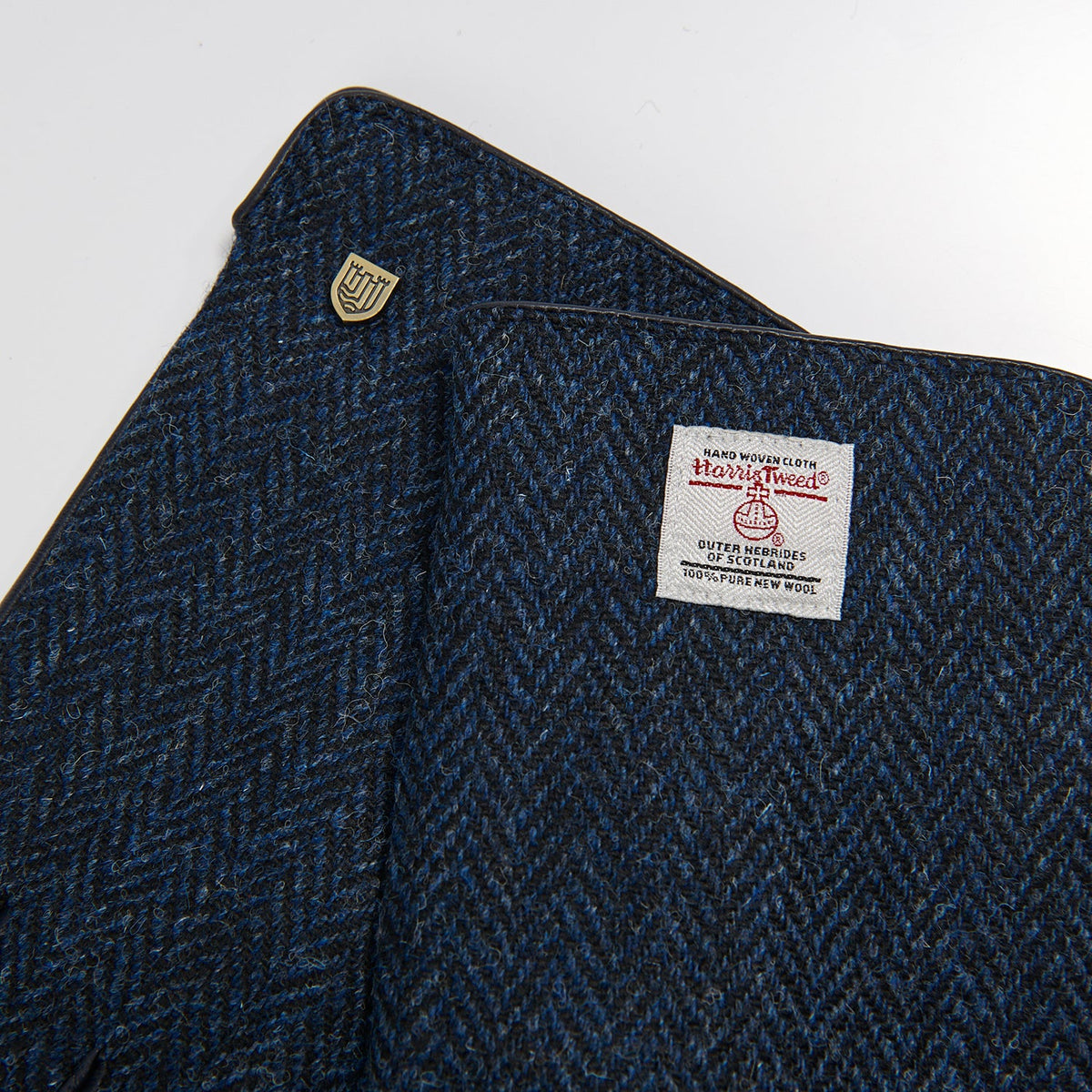 Close-up of a Harris Tweed label on a textured fabric background