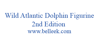 Blue text on a white background reading 'Wild Atlantic Dolphin Figurine 2nd Edition' and 'www.belleek.com'.