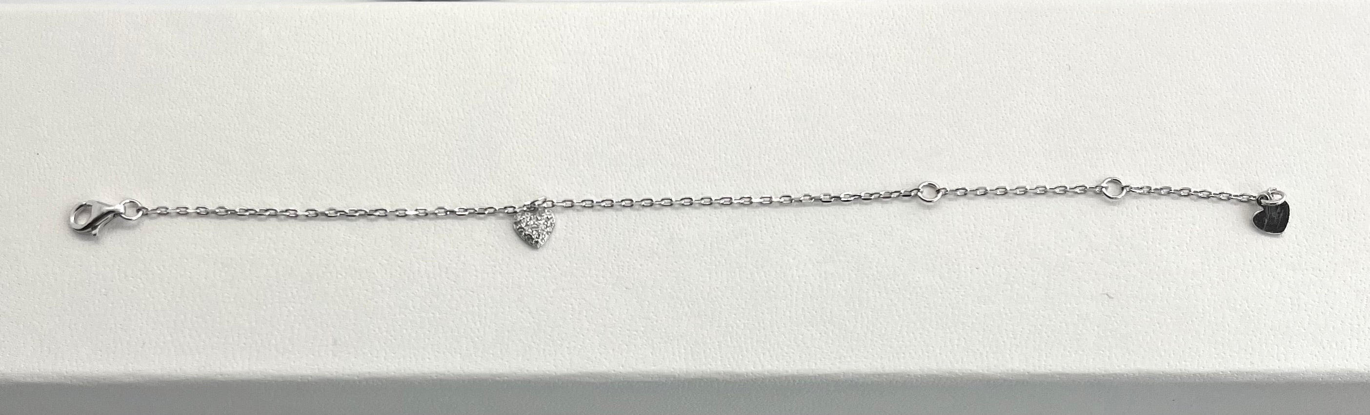 Silver bracelet with heart charms on a white background