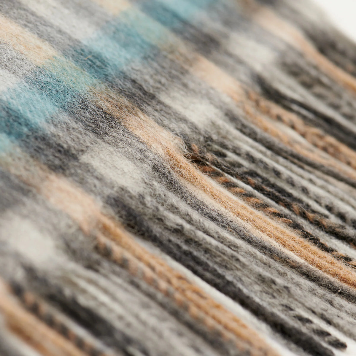 Close-up of a textured fabric with brown, black, and gray colors.