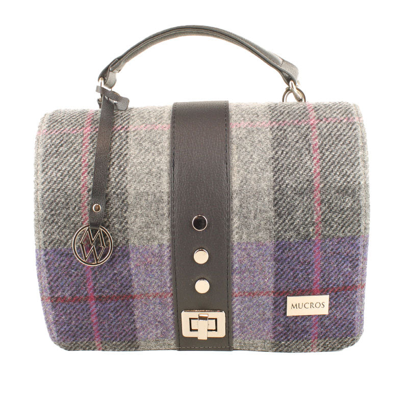 Plaid handbag with leather strap and visible brand logo on a white background
