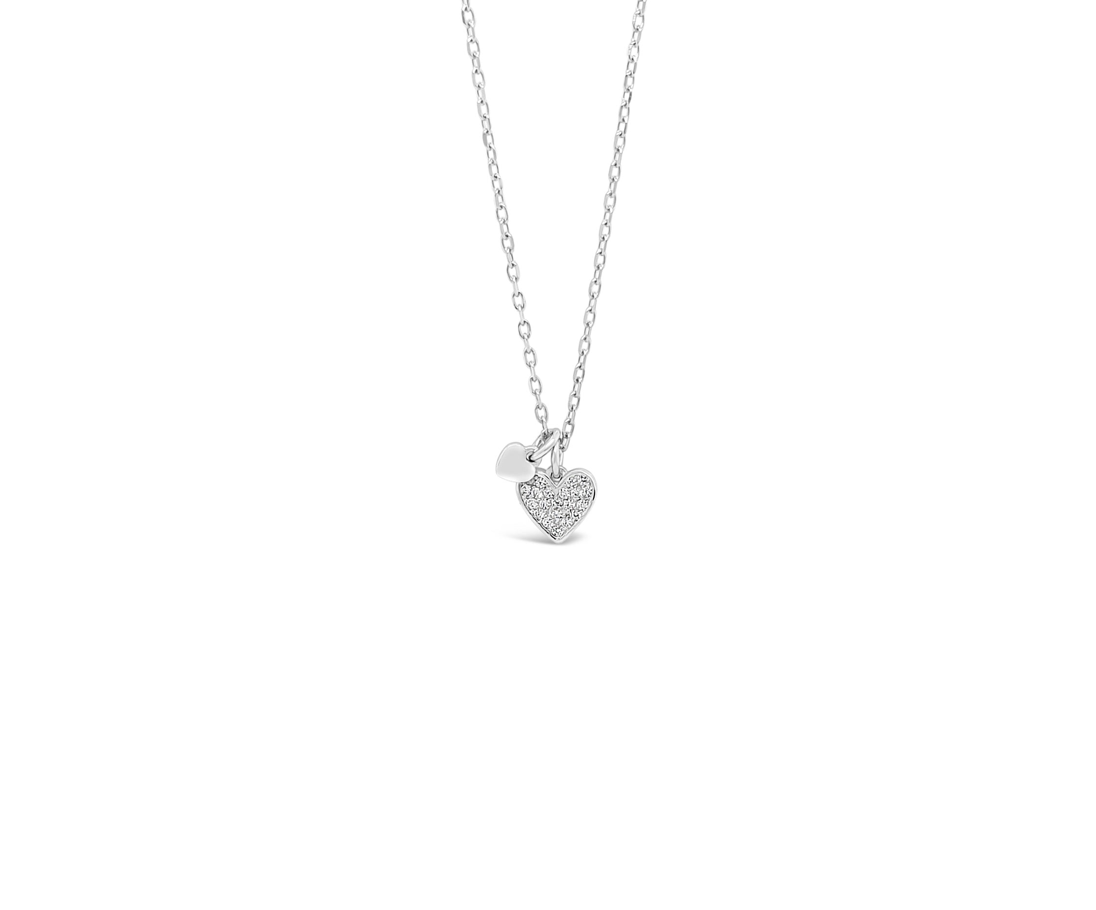 Silver necklace with a heart-shaped pendant on a white background