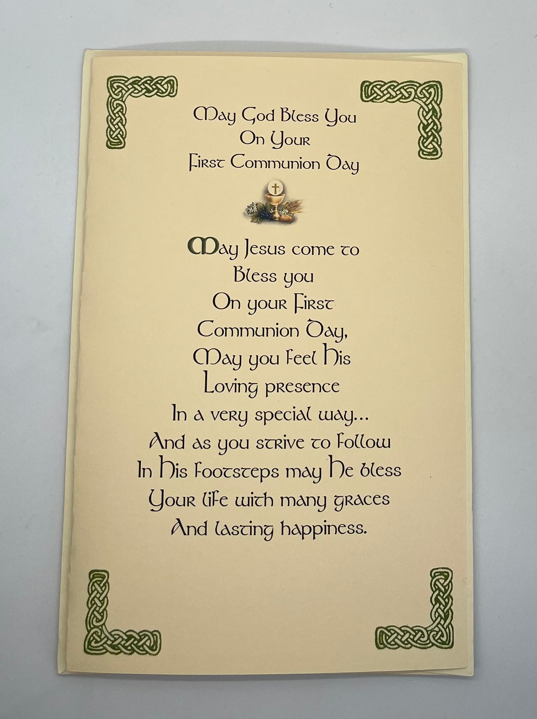 First Communion blessing card with decorative text and design on a plain background