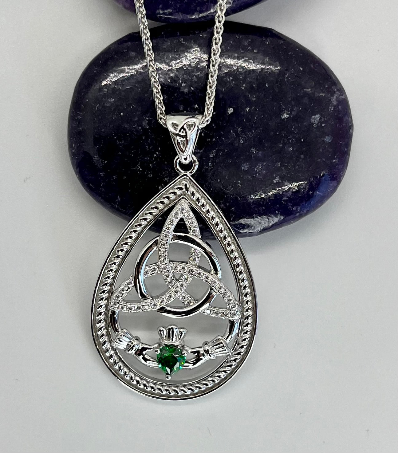 Silver pendant with Trinity Knot & Claddagh design and green gemstone