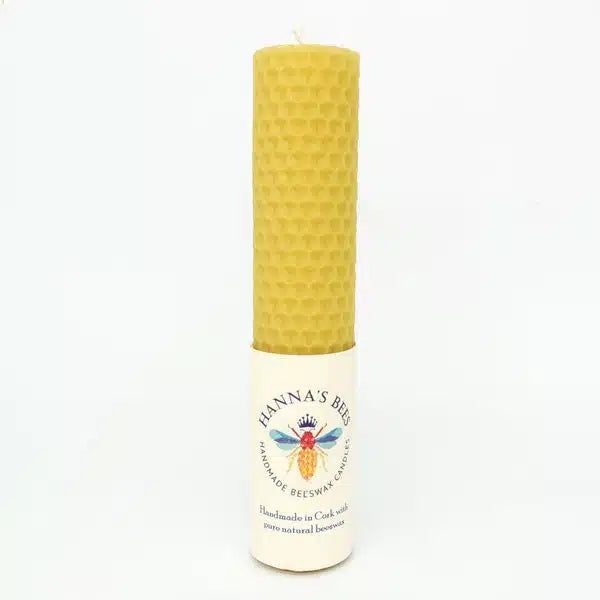Honeycomb-patterned candle with Hanna's Bees branding on a white background