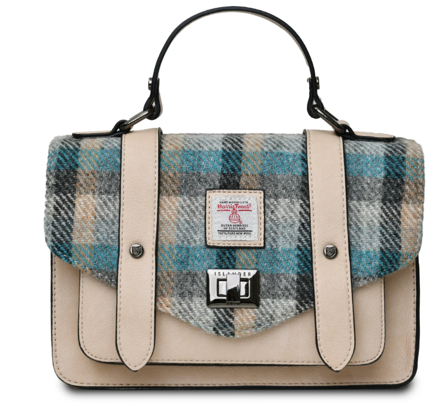 A structured satchel handbag with a beige faux-leather body, a teal and gray plaid patterned flap, and a top handle, shown on a plain white background.