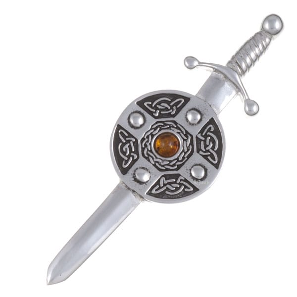 Decorative sword & shield kilt pin on a white background