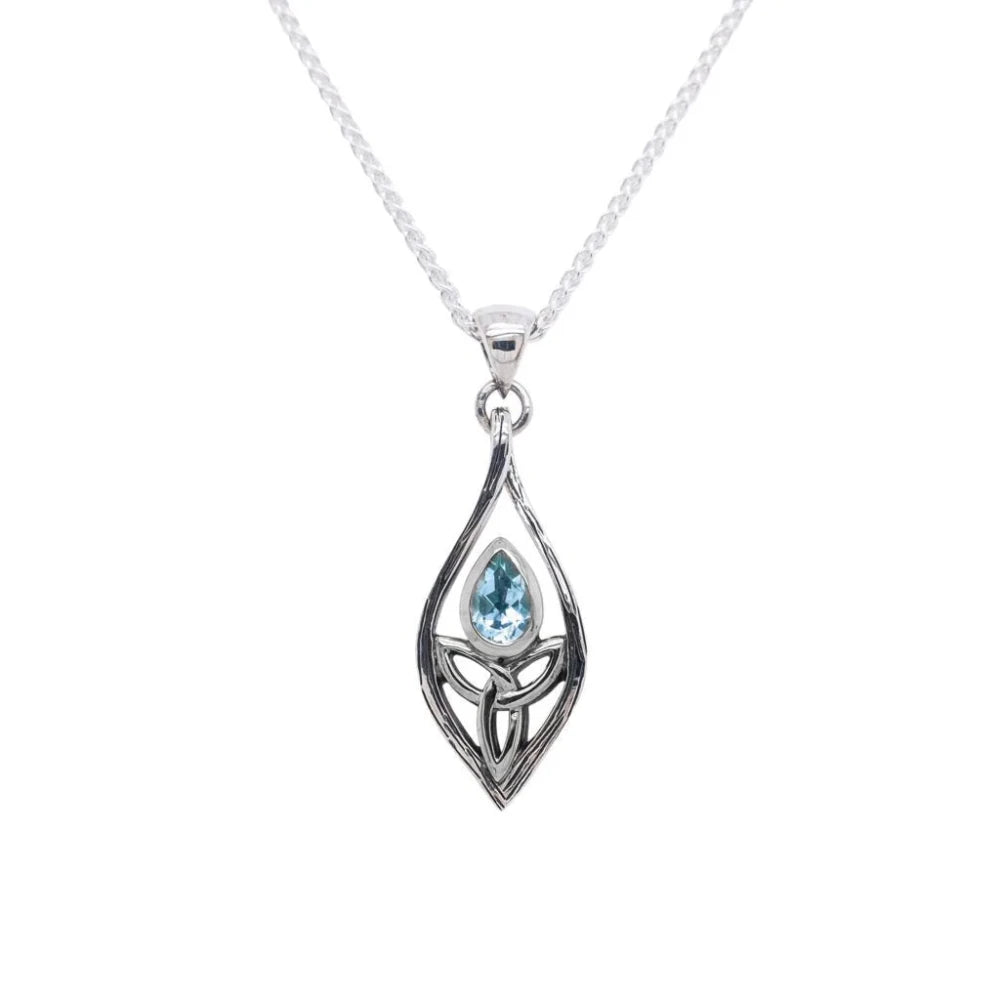 Silver pendant with a blue gemstone on a white background