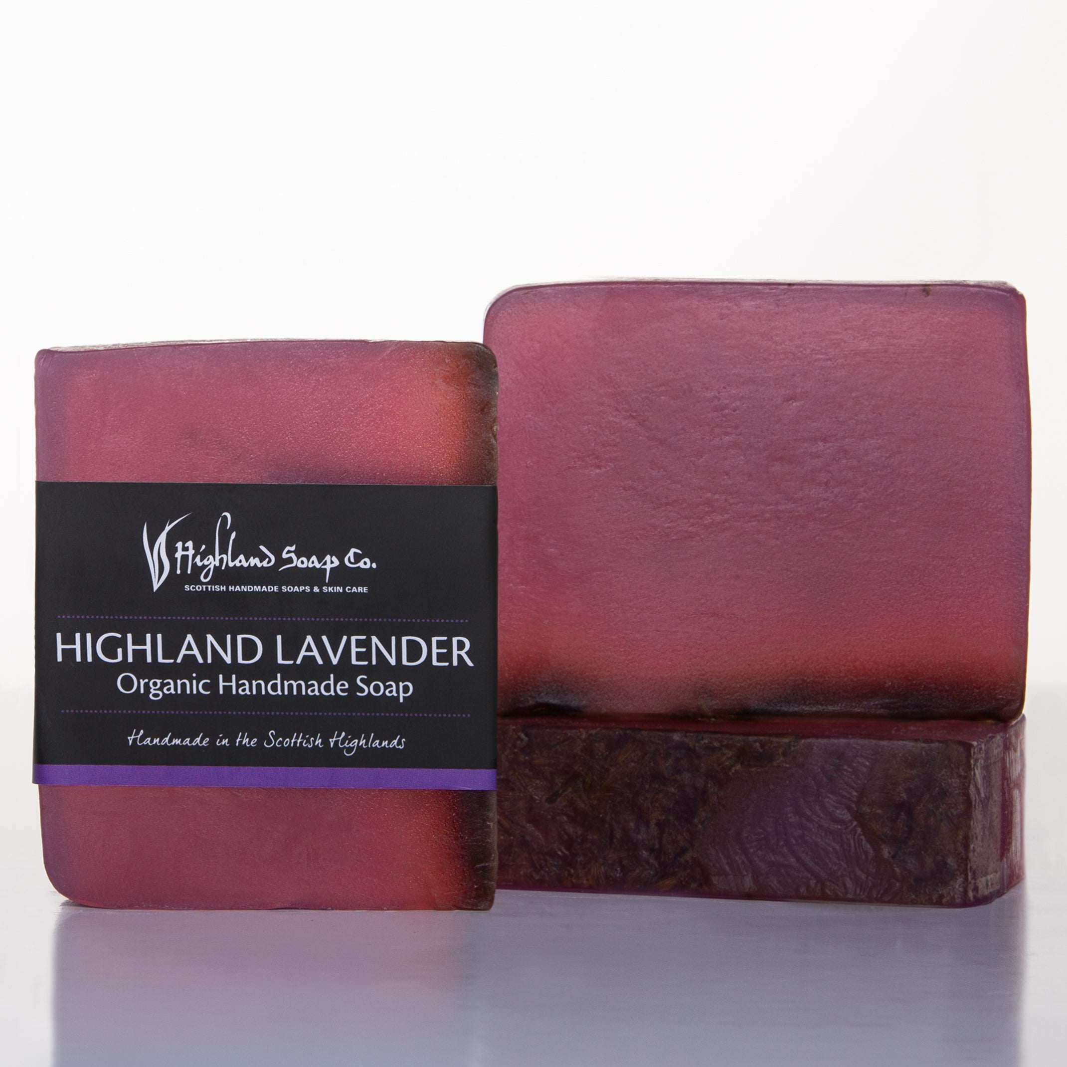 Purple soap bar with a black label on a white background