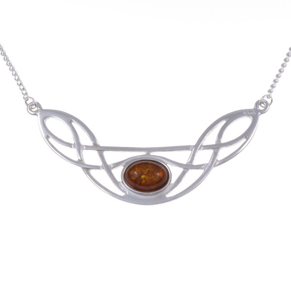 Silver necklace with a Celtic knot design and amber stone on a white background