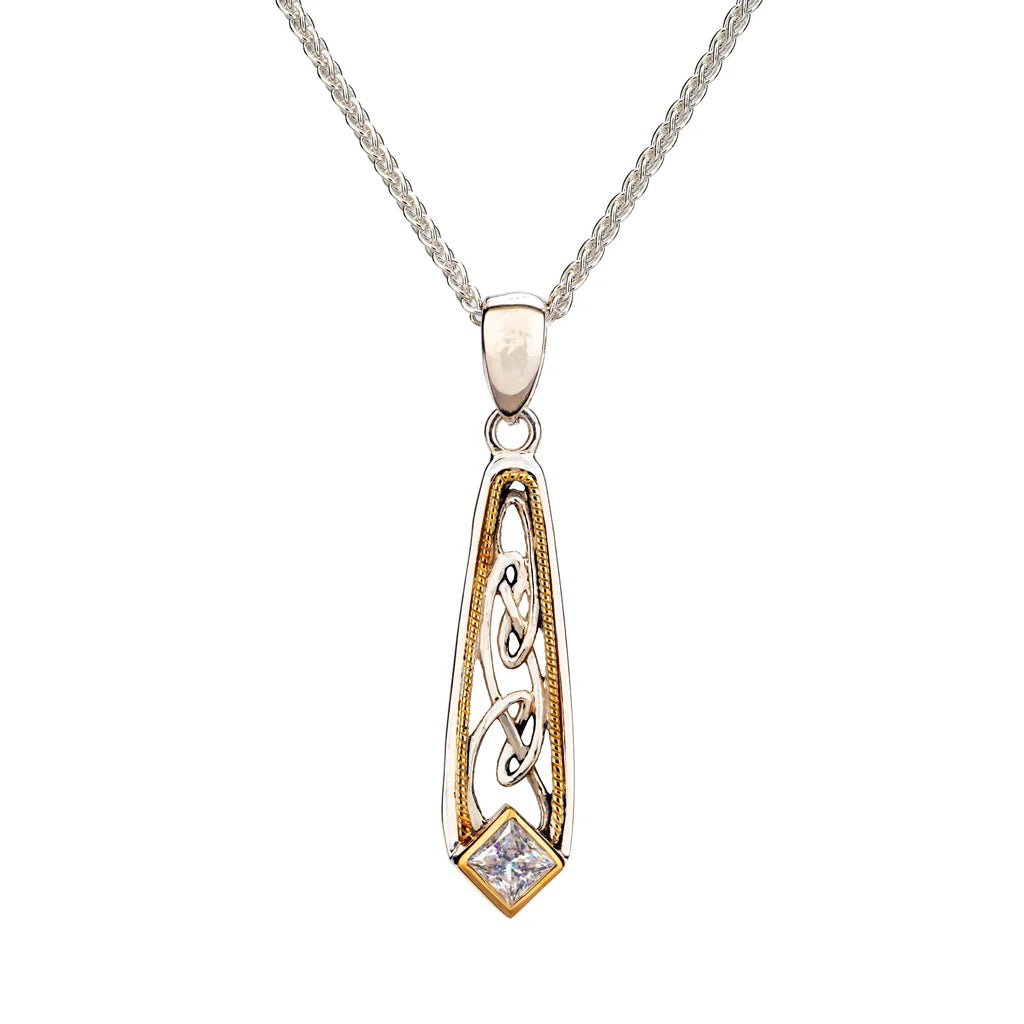 A silver and gold pendant necklace featuring a silver chain and a teardrop-shaped pendant with gold filigree details and a small clear diamond at the bottom.