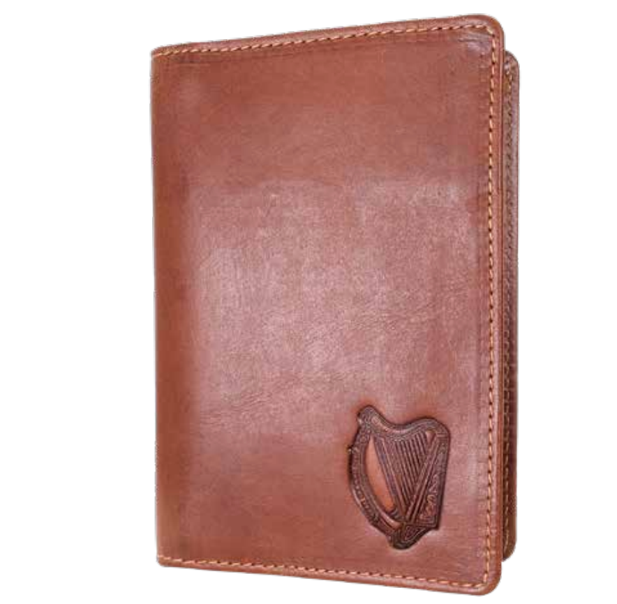 Brown leather passport cover with a harp emblem on a white background