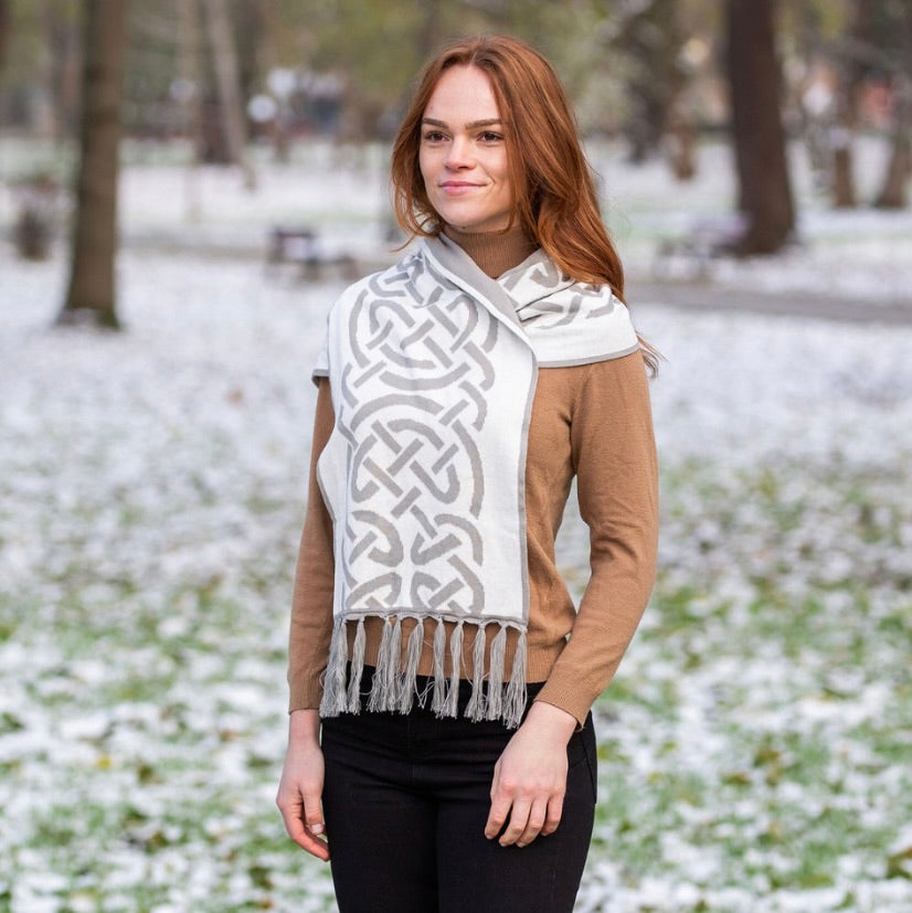 Woman wearing a patterned scarf in a snowy park
