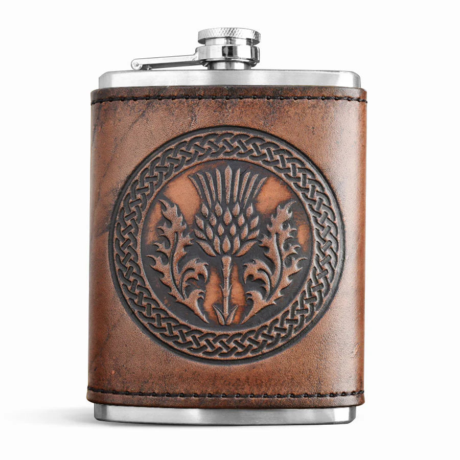 Brown leather flask with embossed design on a white background