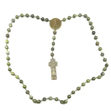A vintage-style religious rosary necklace featuring olive green marbled beads, a round gold-toned medallion, and a silver-toned crucifix pendant, displayed on a clean white background.
