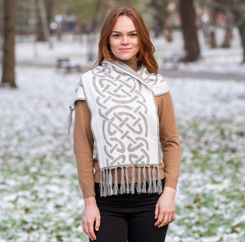 Woman wearing a patterned scarf in a snowy park