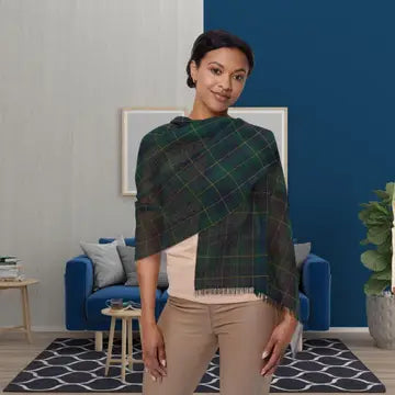 Woman wearing a green plaid shawl in a living room setting