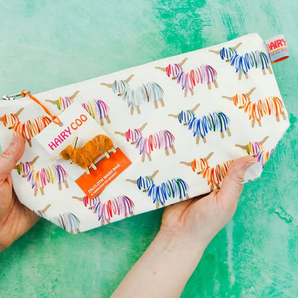 Pouch with colorful yarn design and 'Hairy Coo' branding on a green background