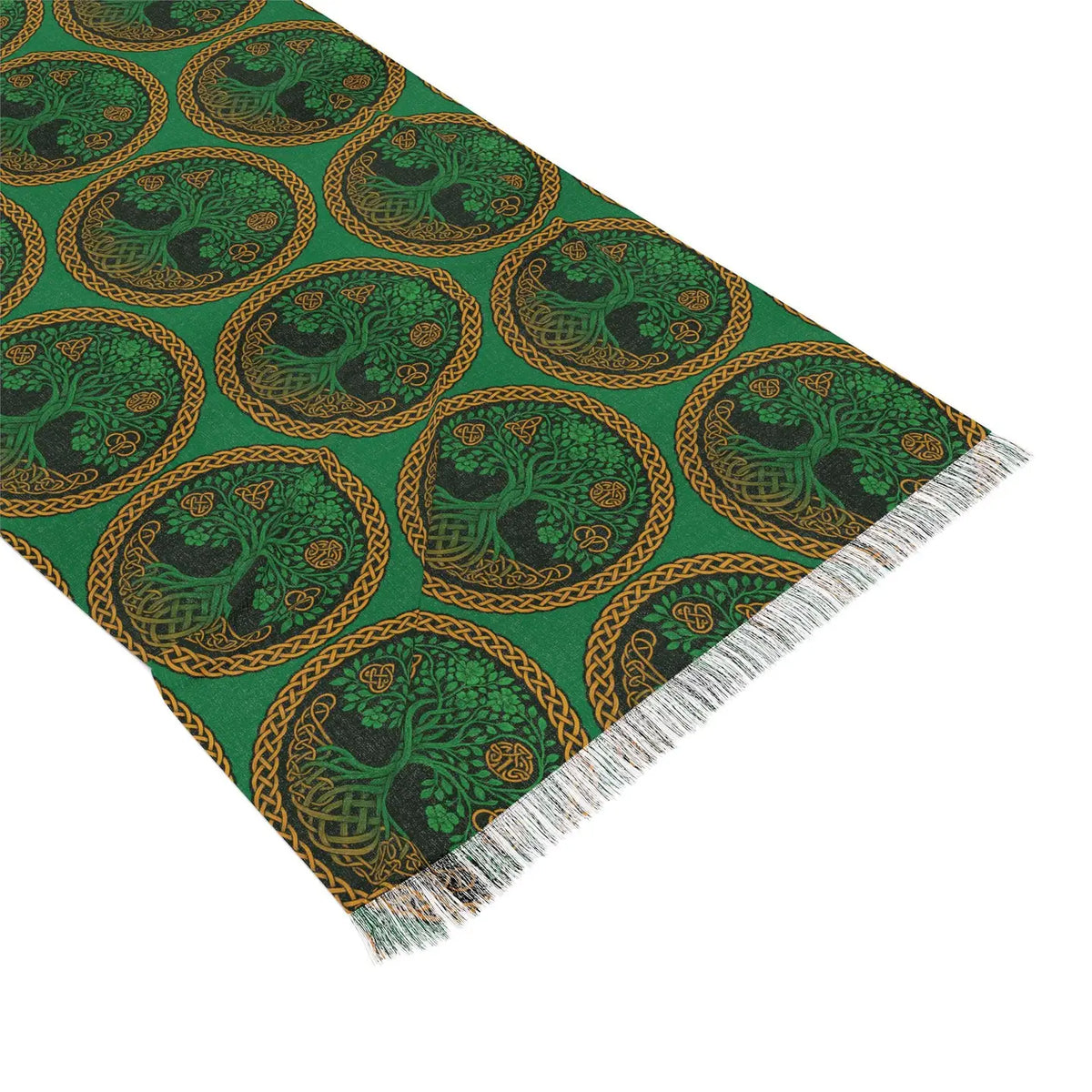 A green woven textile scarf with a repeating circular Celtic-style tree motif in black and gold, finished with white fringe on one end, photographed on a white background.