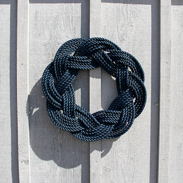 Blue rope knot on a wooden surface