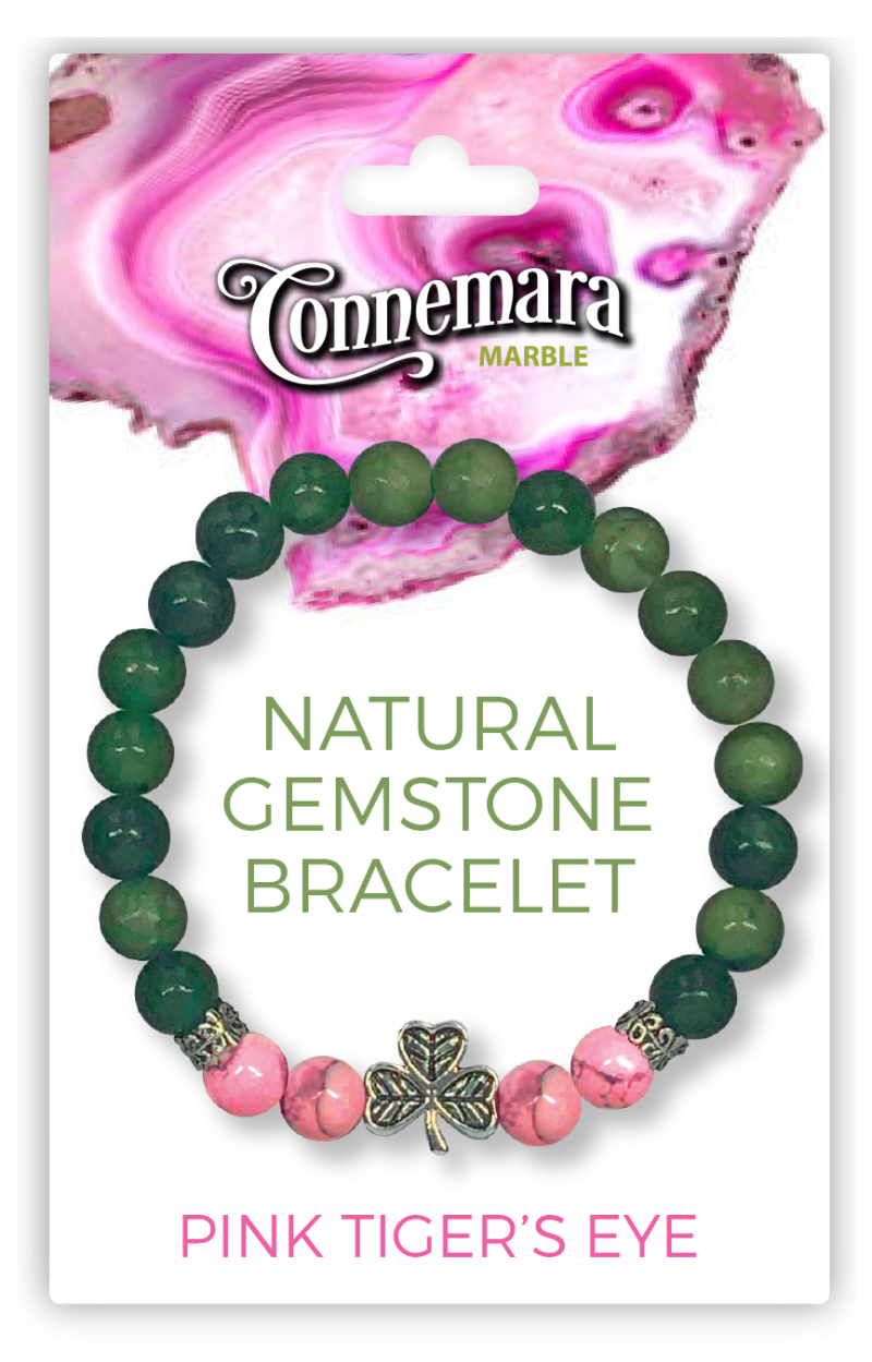Bracelet with green and pink gemstones on a Connemara Marble packaging background