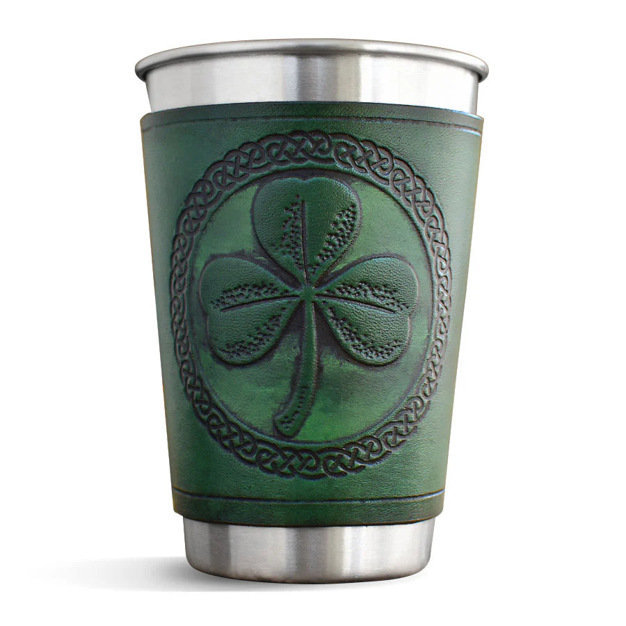 Green leather cup with shamrock design and silver base on a white background