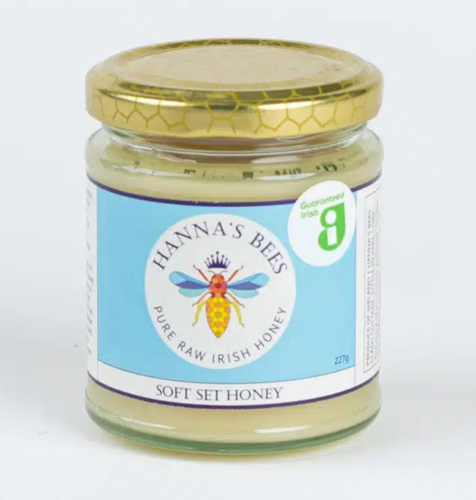 Jar of Hanna's Bees pure raw Irish honey on a white background