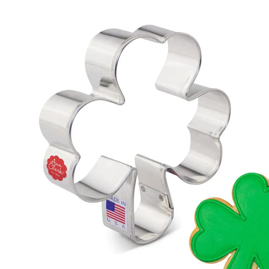 Metallic shamrock-shaped cookie cutter with 'Made in USA' label on a white background