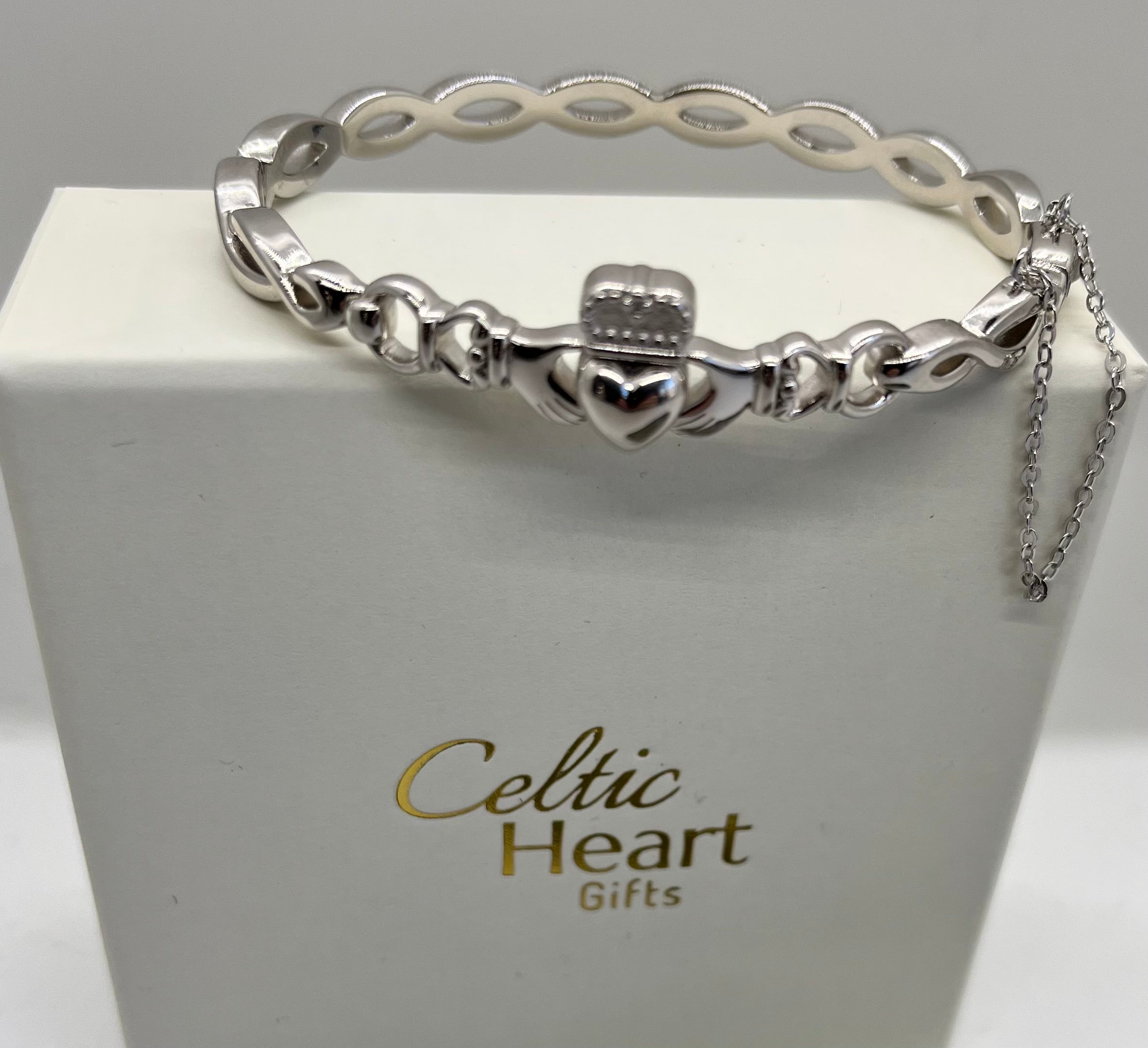Silver bracelet on a white box with 'Celtic Heart Gifts' branding