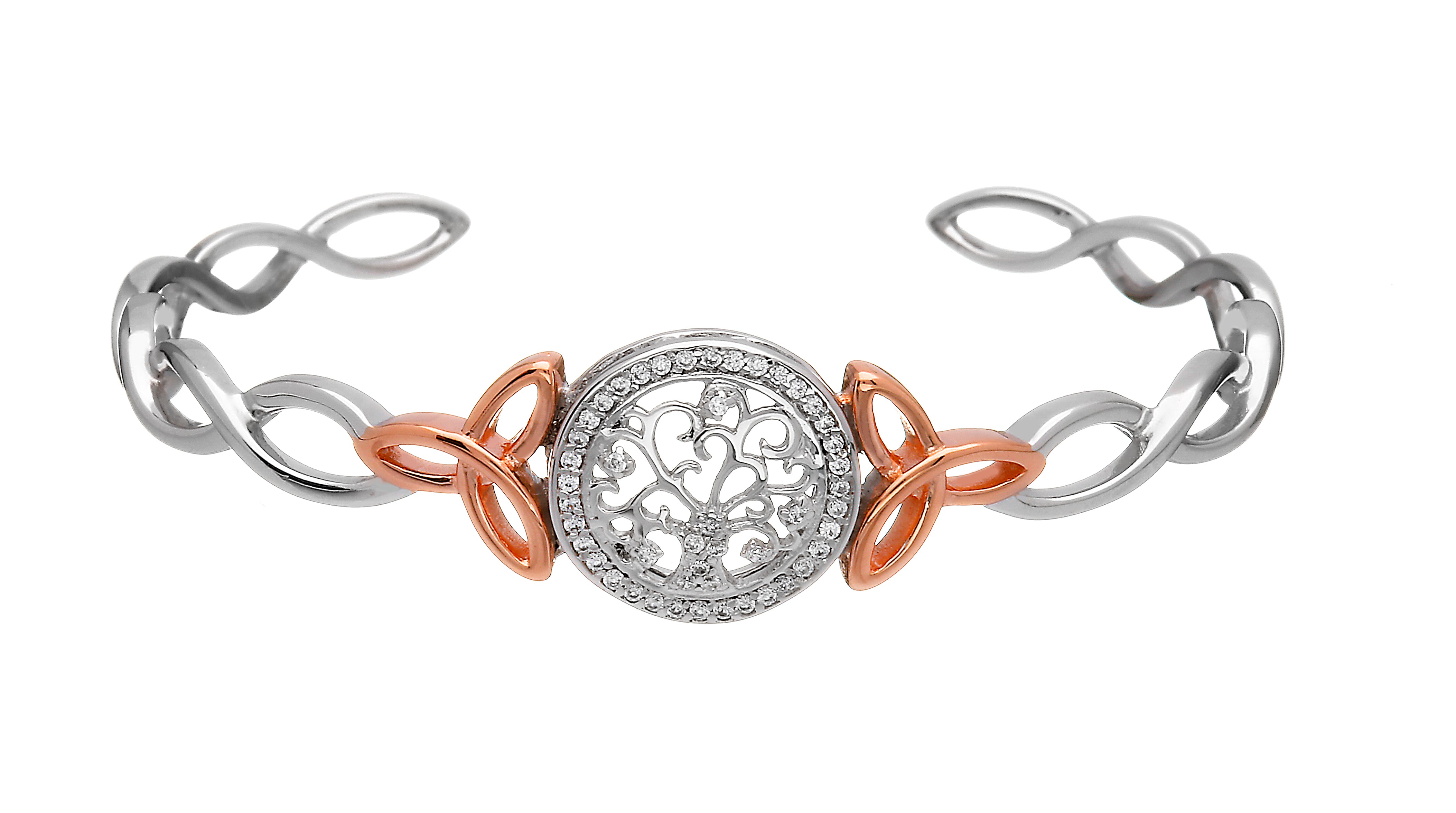 Two-tone bracelet with intricate design on a white background