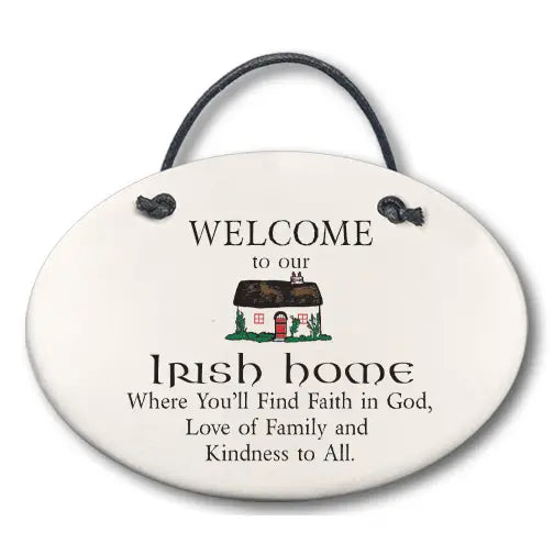 Decorative sign with text 'Welcome to our Irish home' and a small illustration of a cottage.