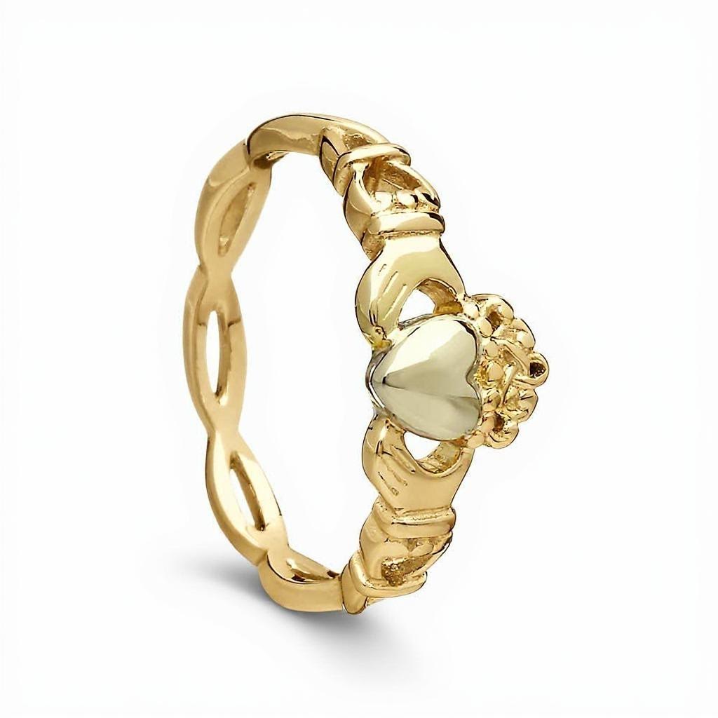 Gold ring with a heart and claddagh design on a white background