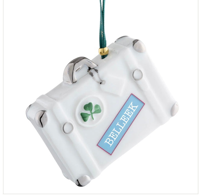 White decorative ornament with a green shamrock and 'Belleek' label on a white background