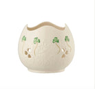 Decorative ceramic vase with clover designs on a white background