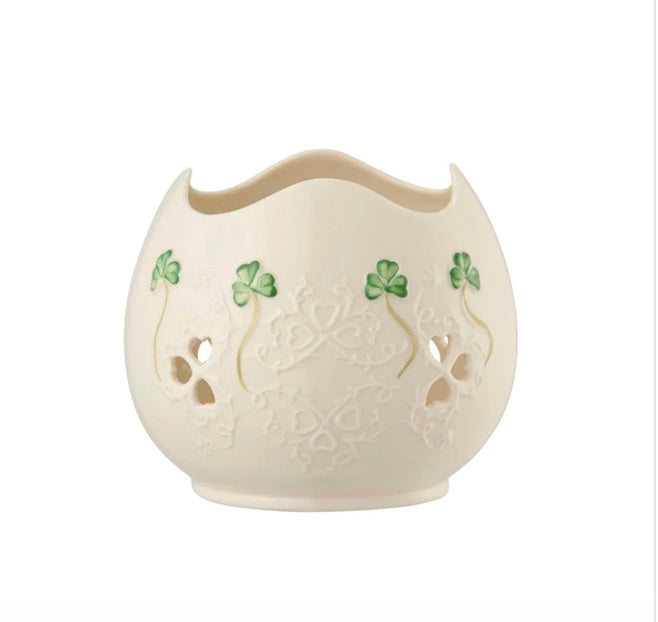 Decorative ceramic vase with clover designs on a white background