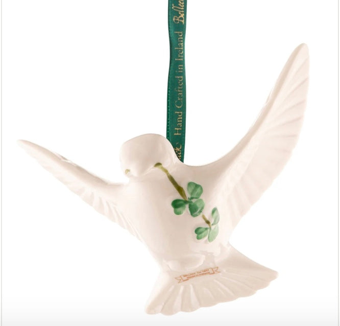 White dove ornament with a clover design on a white background