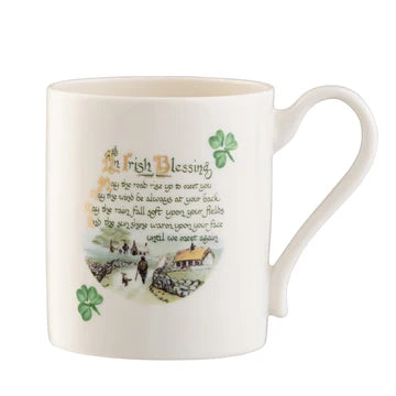 White mug with an Irish blessing and countryside scene on a white background