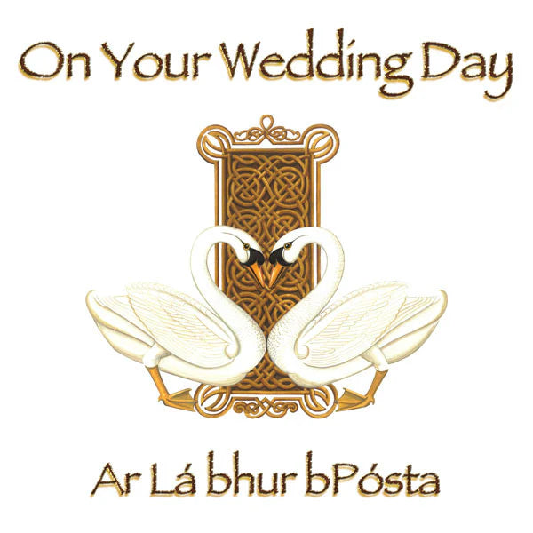 Decorative card with two swans and Celtic knot design, featuring text 'On Your Wedding Day' and 'Ar La bhur bPósta'.