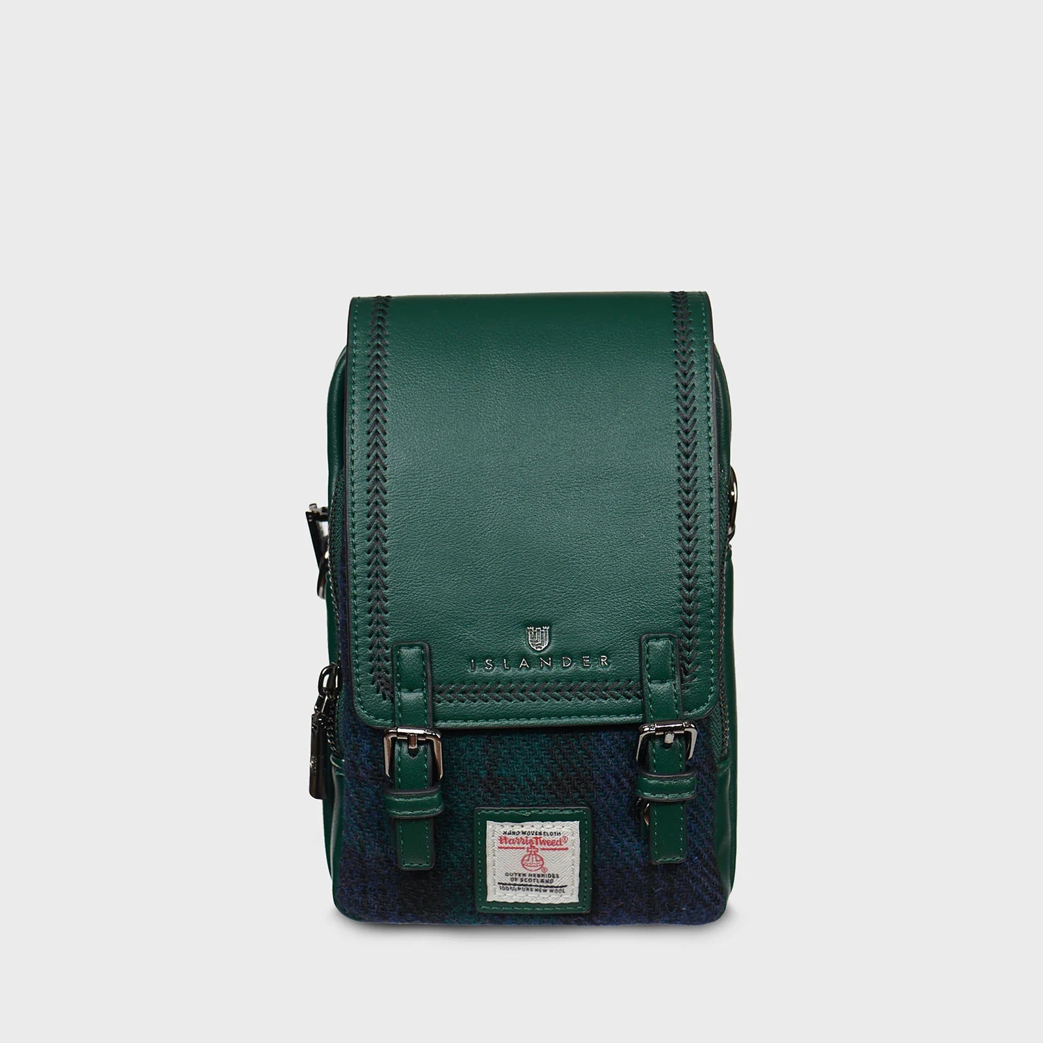 Green leather bag with a visible brand logo on a light gray background