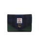 Blue and green fabric wallet with a brand label on a white background