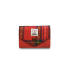 Red and blue plaid wallet with a visible brand label on a white background