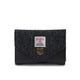 Black textured wallet with a brand label on a white background