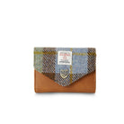 Plaid wallet with brown leather section on a white background