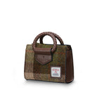Small handbag with plaid pattern and brown leather accents on a white background