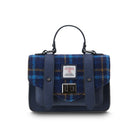 Blue plaid handbag with leather straps on a white background