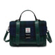 Green and blue checkered handbag with a visible brand label on a white background