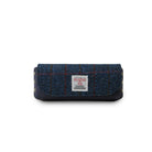 Blue plaid and leather eye glass case with a label on a white background