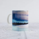 Mug with a gradient design of blue, purple, and black on a light gray background as the Arising Aurora in Scotland