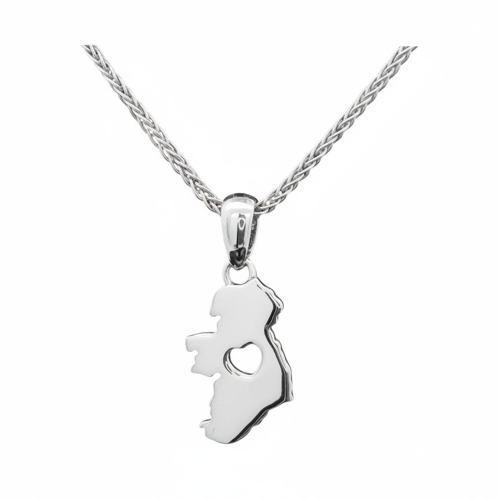 Silver necklace with a pendant shaped like a map of Ireland with a heart in the middle on a white background.